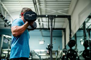 Wheaton Sport Center man working out with dumbbell