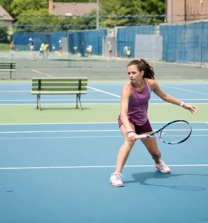 Wheaton Sport Center teen playing tennis