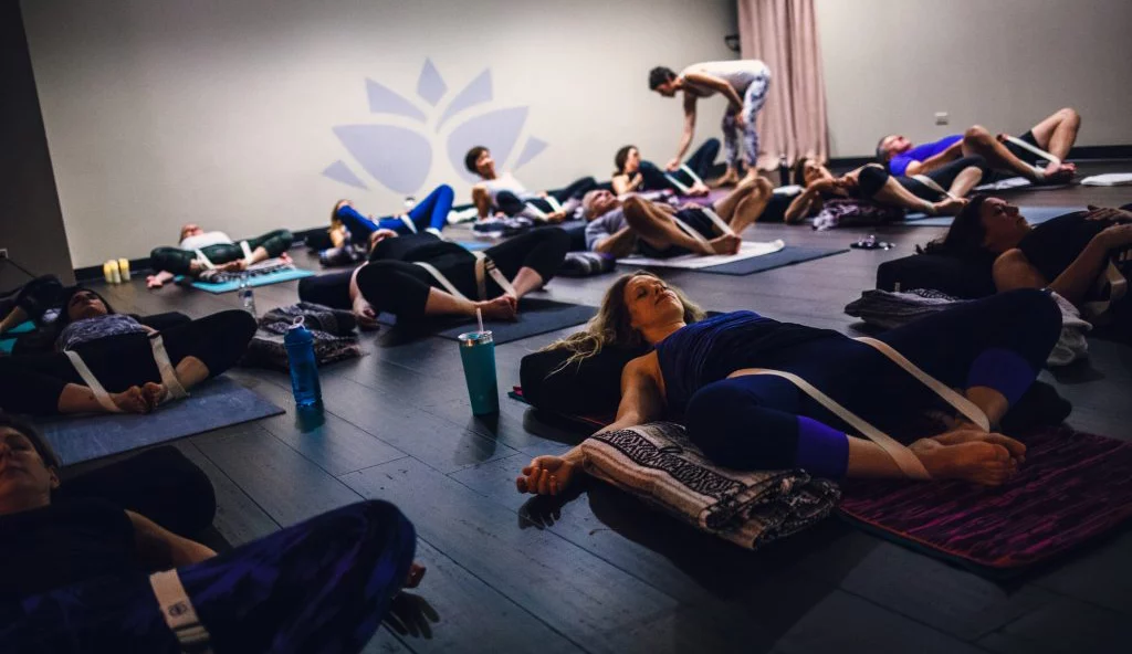 Wheaton Sport Center yoga class relaxes after class in The Studio