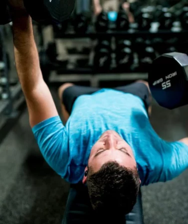 Wheaton Sport Center man working out with weights