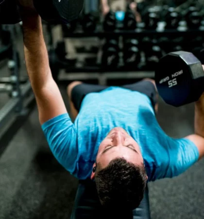 Wheaton Sport Center man working out with weights