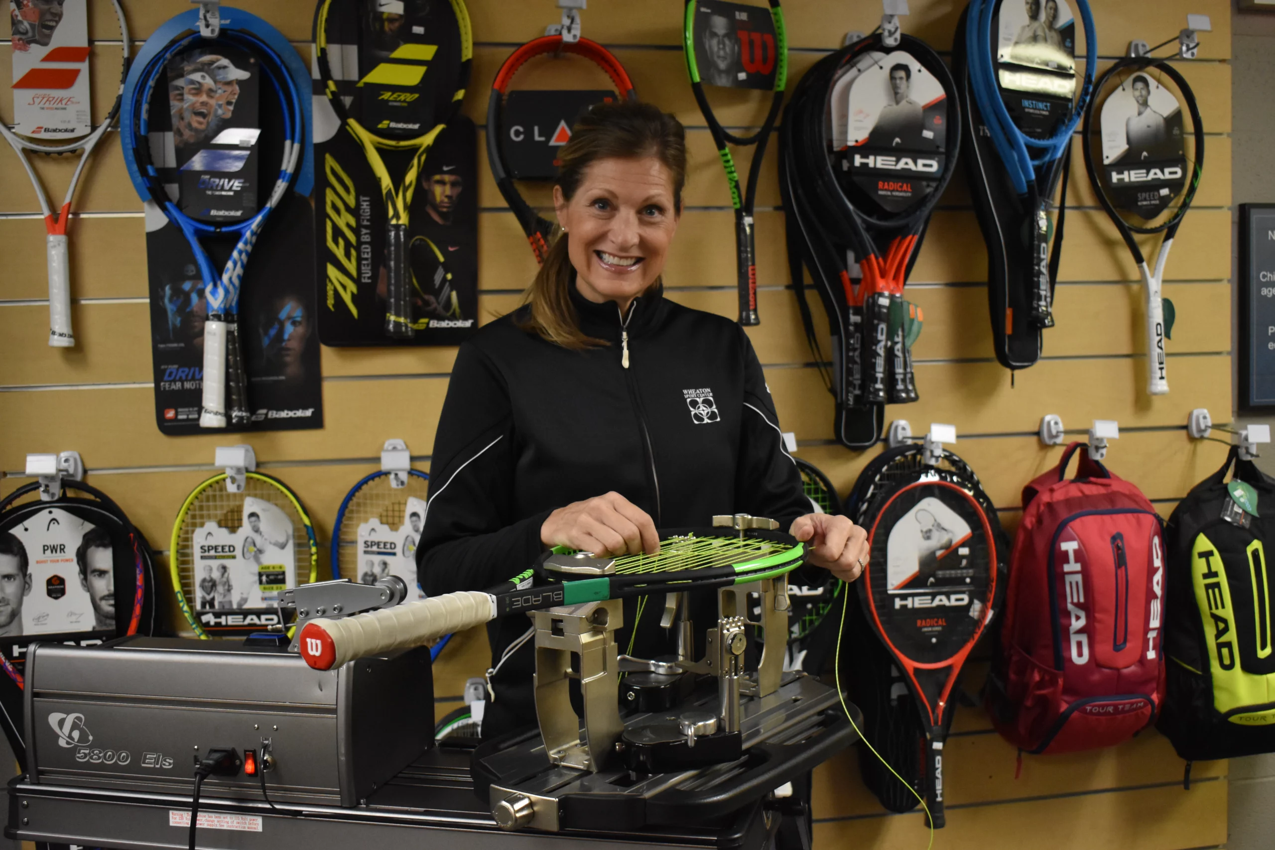 Wheaton Sport Center tennis racket being restrung